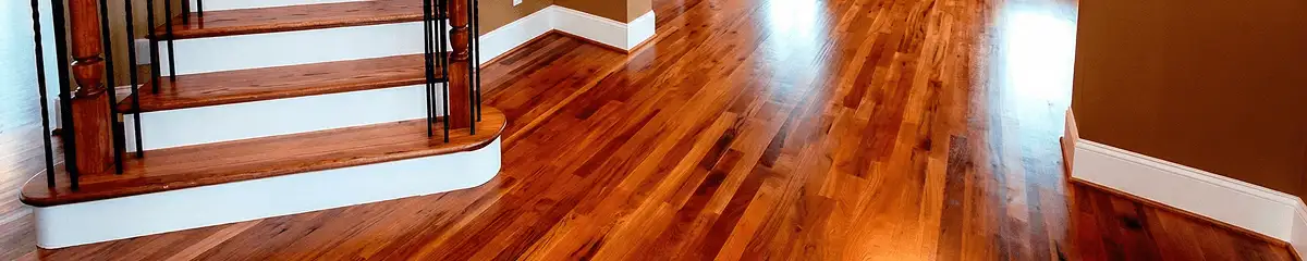 Base floor of a staircase with professionally restored wood flooring in San Diego CA