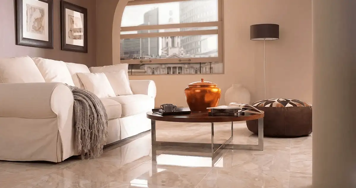 Modern living room with professionally installed marble flooring, a beige sofa, coffee table in San Diego, CA