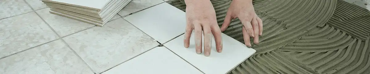 Professional installing white tile floors in San Diego, CA