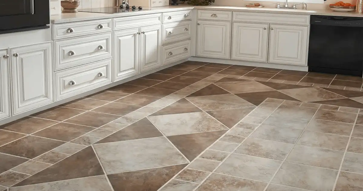 Kitchen with white cabinets and a professionally installed tile floor in San Diego, CA